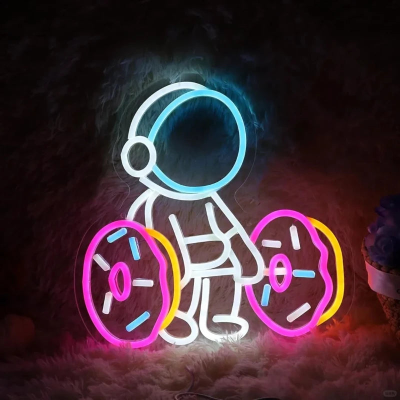 Astronaut Lifting Donut Neon Sign