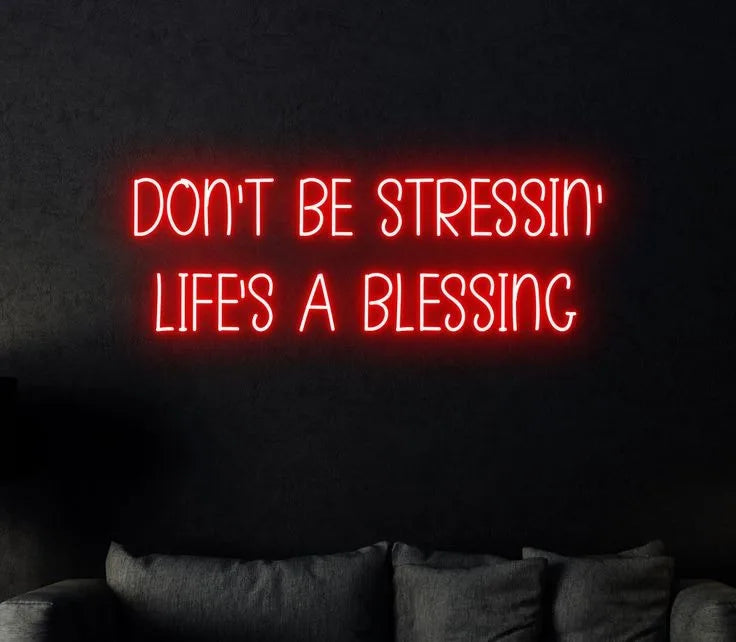 Don't be stressing life's a blessing neon quotes