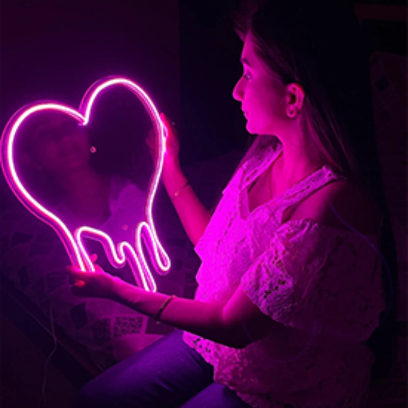 Love neon sign holding with nads